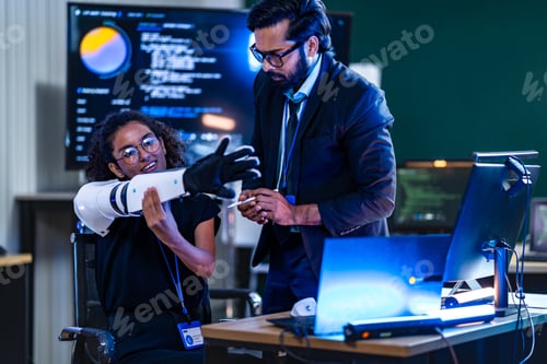 Preview: Black female cybersecurity innovator with a white bionic arm and South Asian male engineer collabora