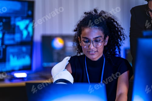 Preview: Black female technology researcher with a white robotic prosthetic arm and a South Asian male specia