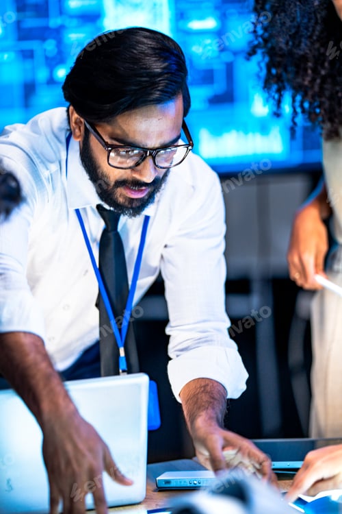 Preview: Diverse AI technology team including South Asian male and Black female professionals presents data o