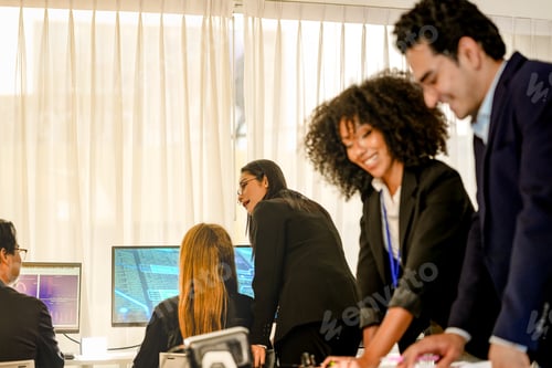 Preview: Professional DevSecOps squad working in a bright command center. Focused female cybersecurity analys