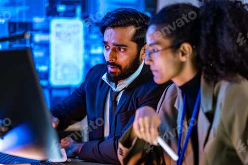 Preview: South Asian Male Tech Lead Showing Code to Team