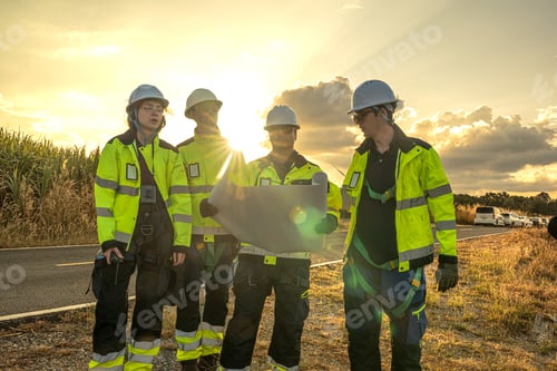 Preview: Wind energy engineering team planning sustainable grid infrastructure at sunset.