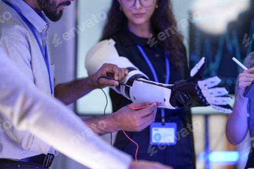 Preview: A team of developers testing the articulation parameters of an AI-driven bionic prosthetic arm proto
