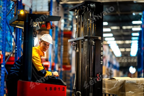 Preview: Caucasian male industrial worker operating heavy forklift truck in large warehouse. Professional dri