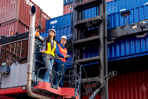 Preview: Forklift moves cargo between stacked shipping containers at a busy logistics shipping container term