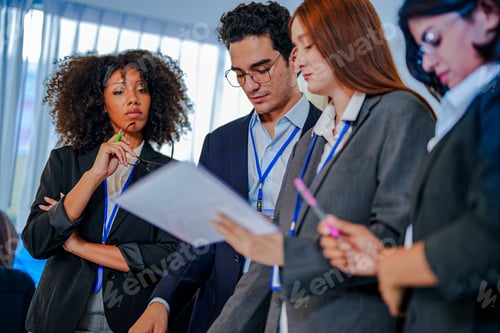 Preview: Focused Black businesswoman and diverse executives analyzing a business plan. Corporate professional