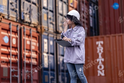 Preview: Asian Woman Logistics Workers Walking to Check Container. Operations at a Busy Shipping Container Ya