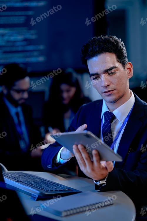 Preview: A data analyst scrolls through complex visualizations on a tablet comparing results against code dis