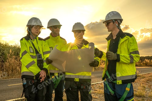 Preview: Wind energy engineering team planning sustainable grid infrastructure at sunset.