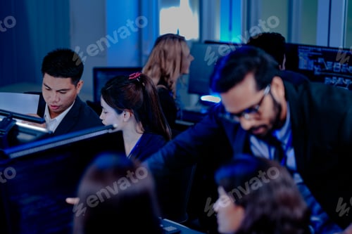 Preview: High-energy tech team collaborates late night. A manager provides rapid guidance, driving project pr