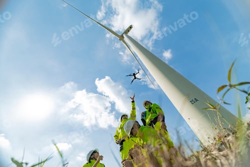 Preview: Engineers use a drone to inspect a wind turbine on a bright day, showcasing the integration of techn
