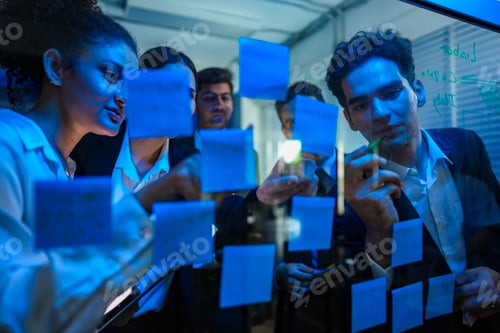Preview: Cyber security team laughing and celebrating a successful system defense simulation in a modern, blu