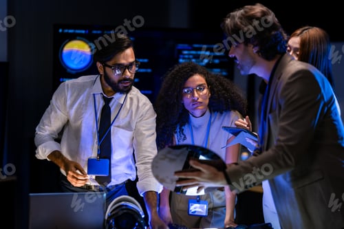 Preview: Male presenter in a tan blazer delivers a tech briefing in a dark room; blue automotive AI visualiza