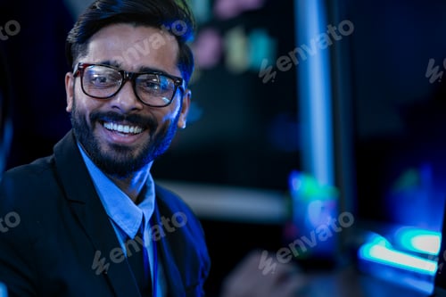 Preview: Portrait of a smiling tech entrepreneur discussing artificial intelligence program breakthroughs and