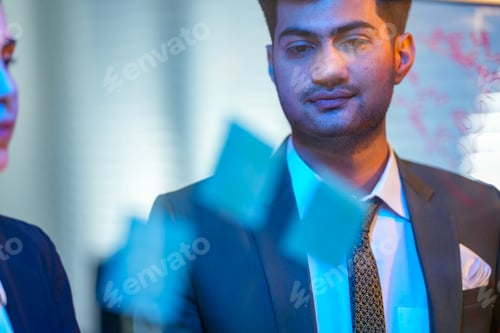 Preview: Abstract view of a modern corporate office at night with blurred light reflections, creating a calm