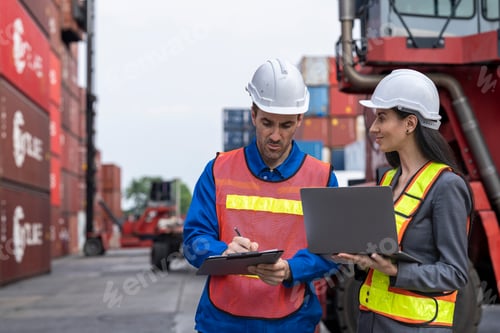 Preview: Two logistics workers man and woman discuss operations at a busy shipping container yard.