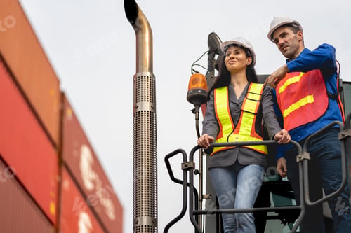 Preview: Two logistics workers man and woman discuss operations at a busy shipping container yard. successful