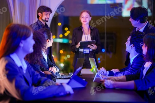 Preview: Diverse team of professionals having a strategic business briefing and collaboration session in a mo