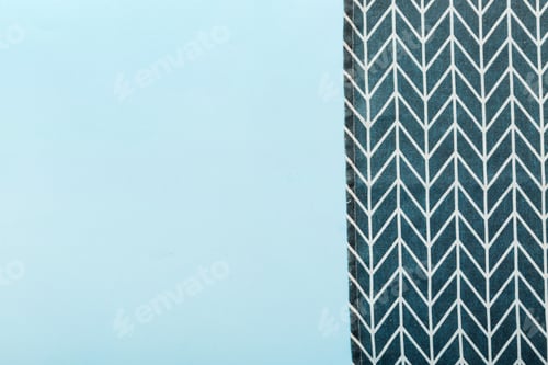 Preview: top view with blue kitchen napkin isolated on table background. Folded cloth for mockup with copy sp