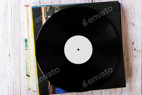 Preview: Pile of old vinyl records on wooden background