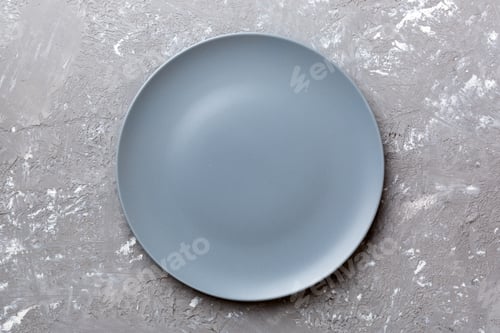 Preview: Top view of empty grey plate on cement background. Empty space for your design