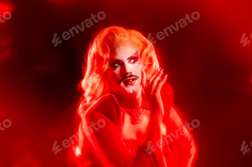 Preview: Portrait of a Drag Queen With Red Light in a Studio During a Queer Event at Night