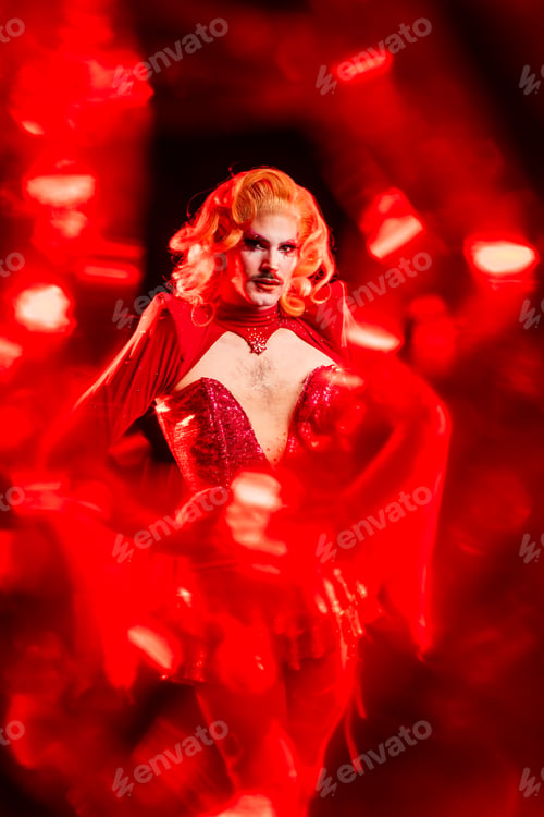 Preview: Fabulous Drag Queen in Red Light Performing in a Studio Setting With a Dynamic Background