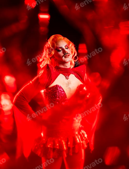 Preview: Portrait of a Drag Queen in Red Light at a Studio Setting Featuring Queer Culture