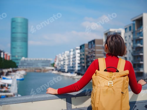 Preview: Tourist woman explores modern Frankfurt,