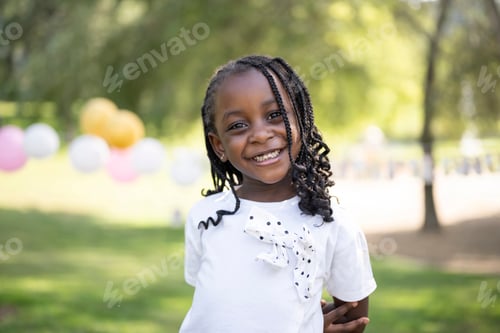 Preview: African american girl smiling at park birthday party