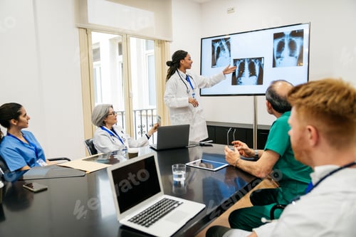 Preview: Doctors and nurses discussing x rays in a medical conference