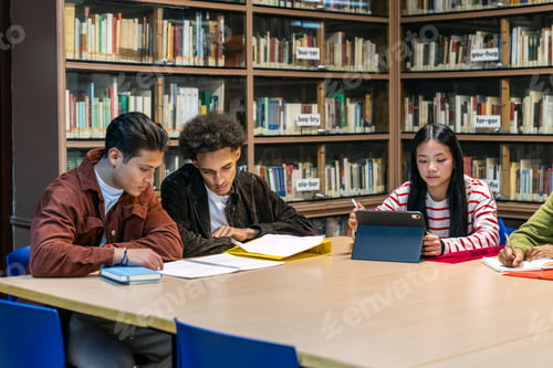 Preview: Diverse students studying together in library