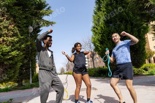 Preview: Diverse friends exercising outdoors with fitness equipment