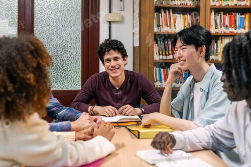 Preview: Diverse students and teacher studying together in library
