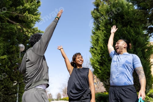 Preview: Diverse friends achieving fitness goals, celebrating success outdoors
