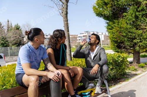 Preview: Diverse friends resting after outdoor exercise and jogging