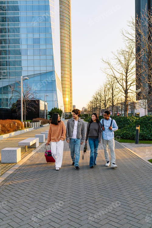 Preview: Diverse friends walking city street at sunset