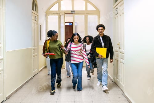 Preview: Diverse students walking hallway together in school building