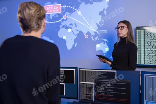 Preview: Team collaborating in a SOC monitoring critical cybersecurity events on a world map