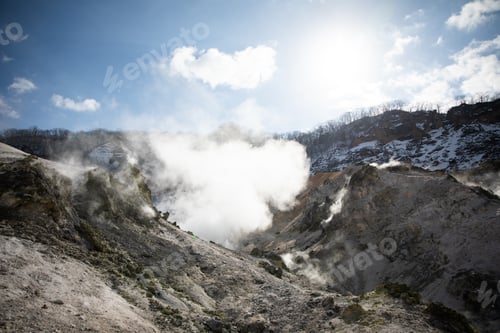 Preview: Steam Rising Volcanic Landscape Under Blue Sky