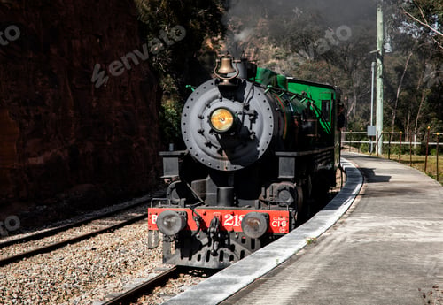 Preview: Vintage steam locomotive on sunny day railway track