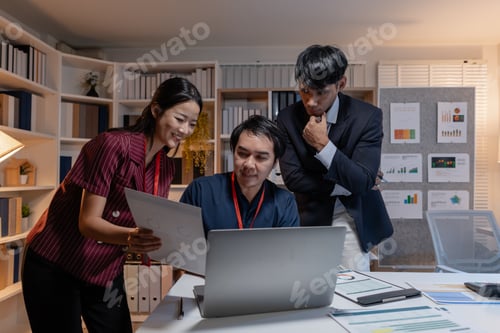 Preview: Business team discussing work together in office, analyzing reports and data on laptop and documents