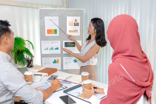 Preview: A team of diverse professionals engaged in a business presentation, discussing data and strategies t