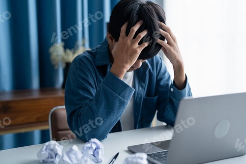 Preview: Stressed Man Struggling to Generate Ideas in Office