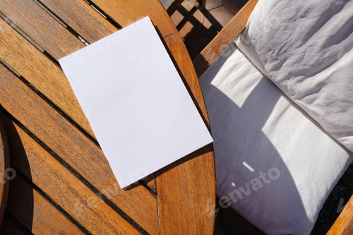 Preview: White Book on Shiny Wooden Coffee Table , Hard Light