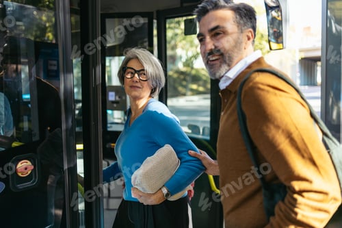 Preview: Happy mature adults commuting with public transport for sustainable travel.