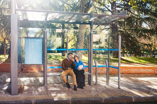 Preview: Senior couple waiting at city bus stop