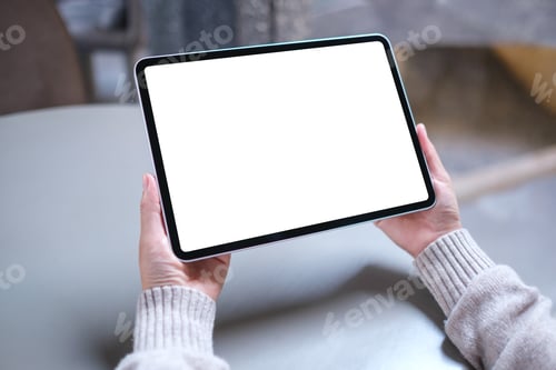 Preview: Mockup image of a woman holding digital tablet with blank white desktop screen
