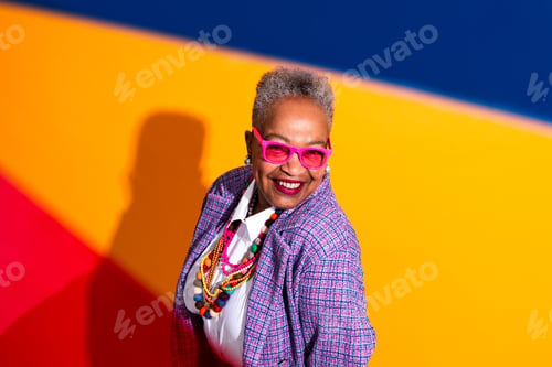 Preview: Senior woman smiling wearing colorful eccentric fashion