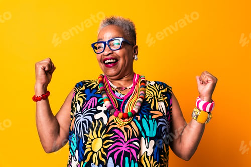 Preview: Senior woman celebrating success and feeling empowered